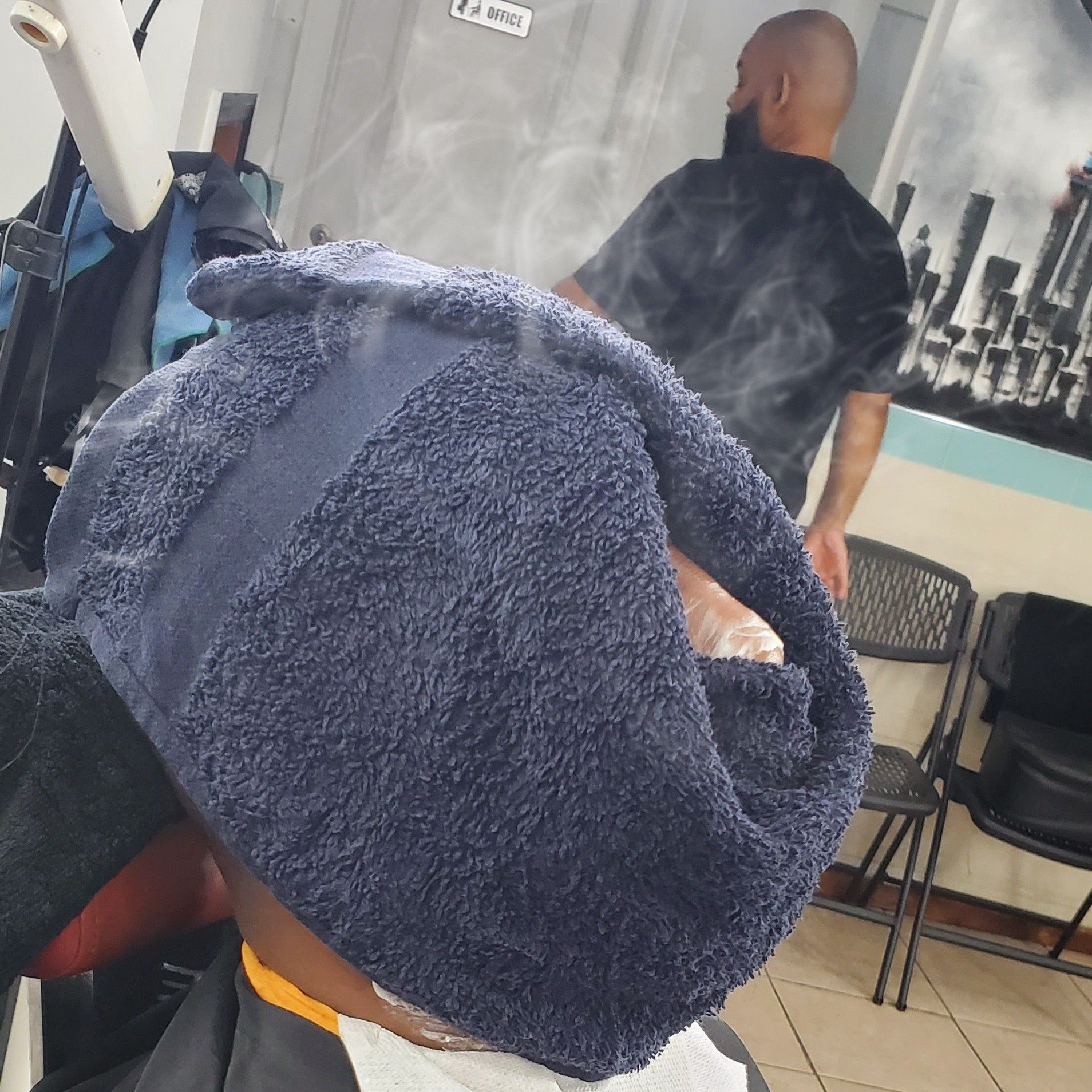 Barber finish work at EDNICE718 Brooklyn's Finest